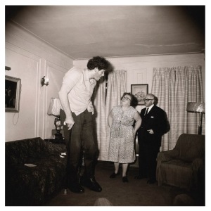 A Jewish giant at home with his parents in the Bronx, N.Y.C.. 1970